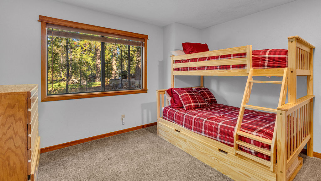 Bunk bedroom with twin bunk bed and trundle